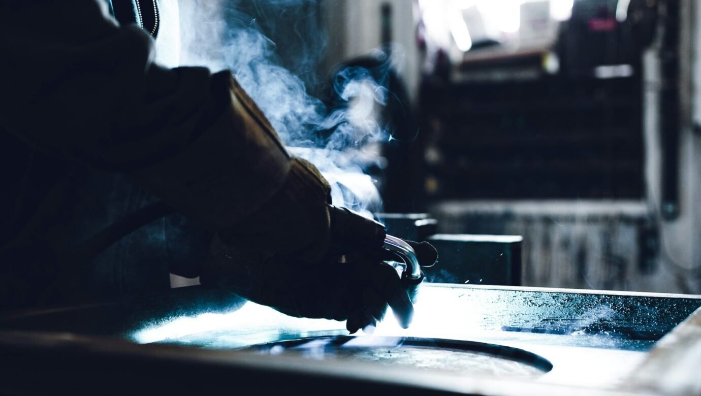 man in black jacket smoking