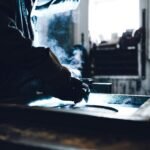 man in black jacket smoking